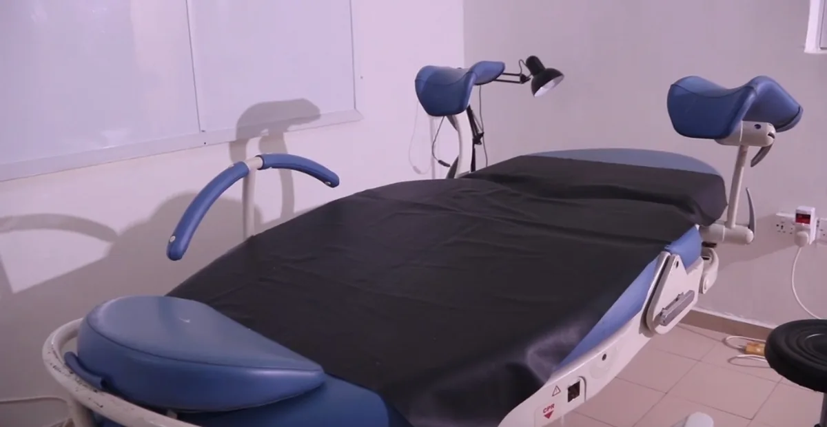 Blue lithotomy bed in the procedure room